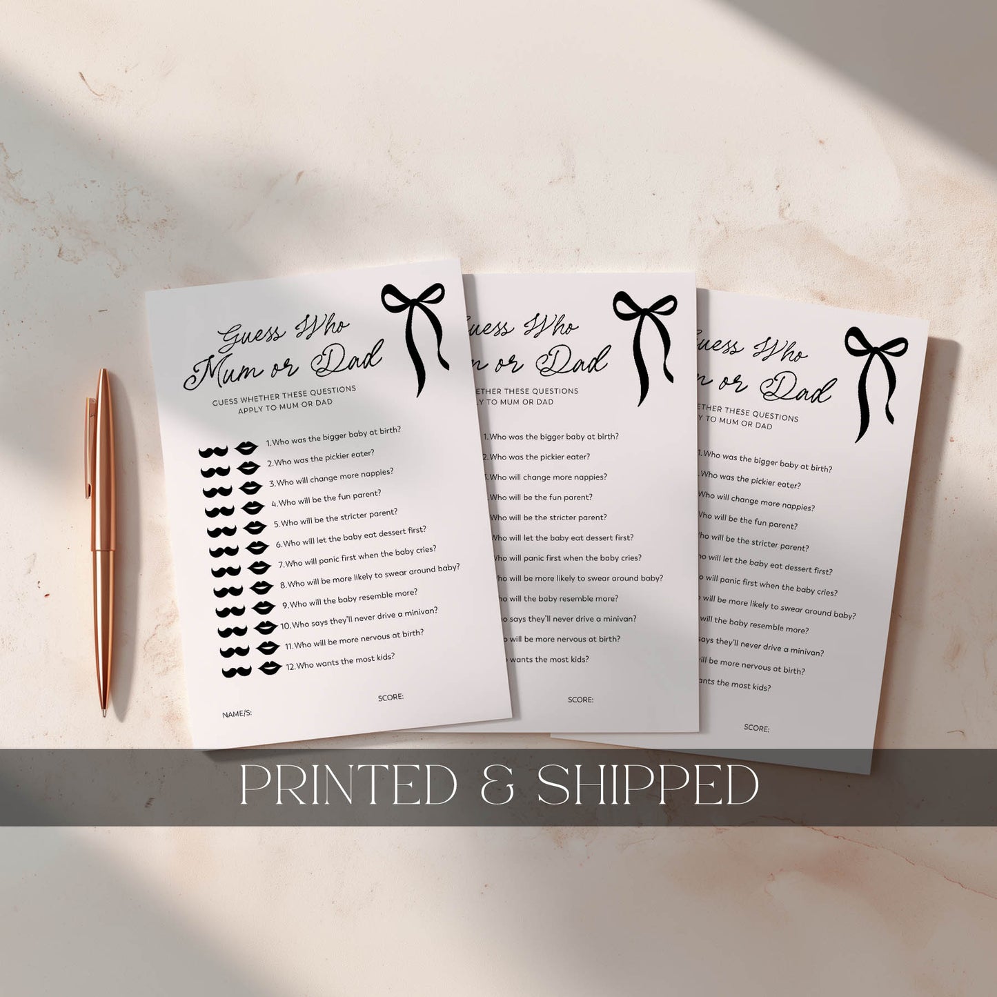 Black Bow Three printed questionnaires titled 'Guess Who's Mum or Dad?' on a light surface with a pen.