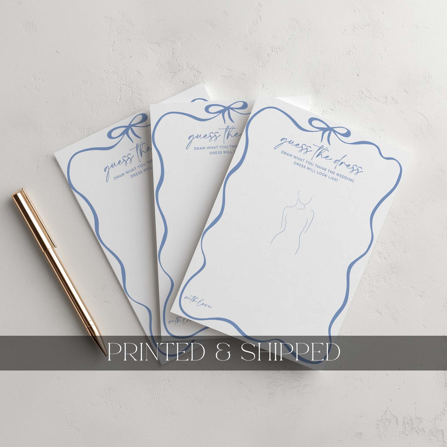 Three 'Guess the Dress' cards with blue ribbons on a light gray background.