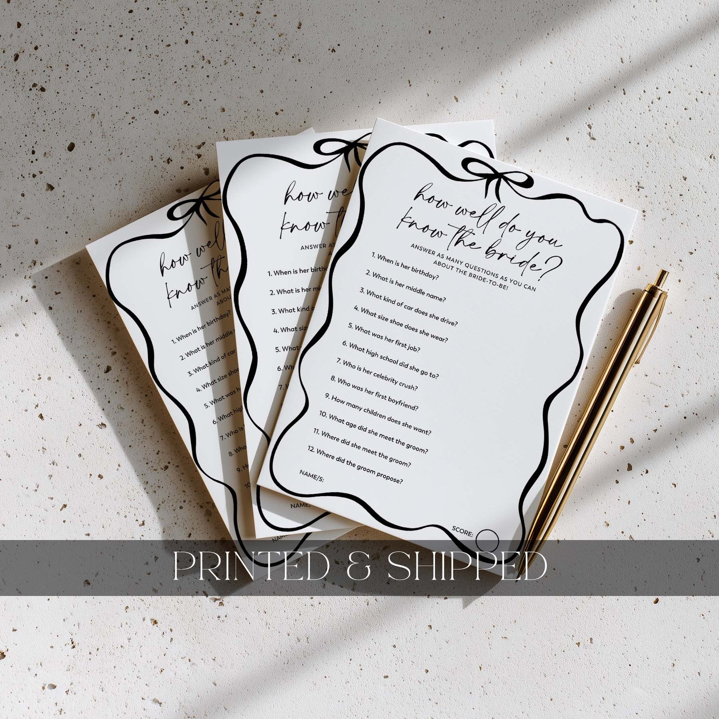 Three printed questionnaires titled 'How well do you know the bride?' on a textured surface with a pen.