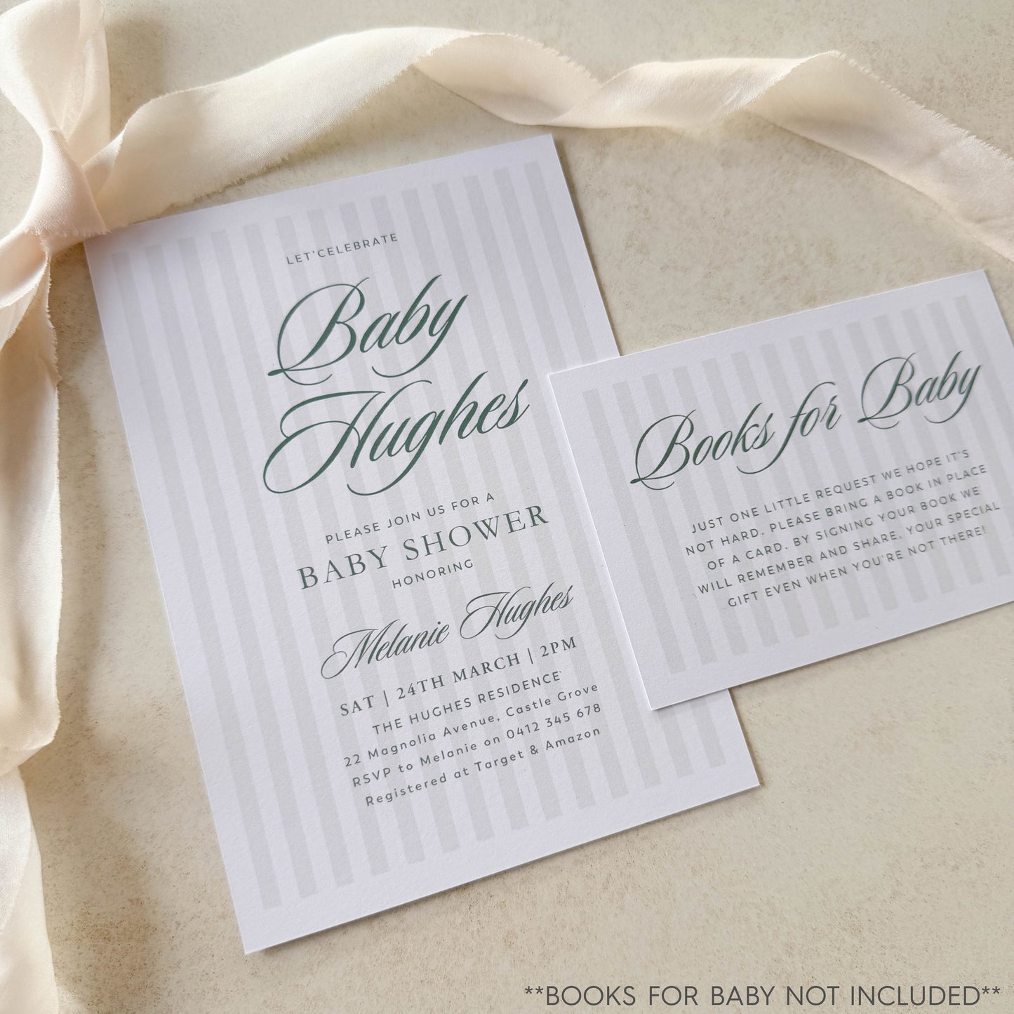 Baby shower invitation with 'Books for Baby' card on a beige fabric background