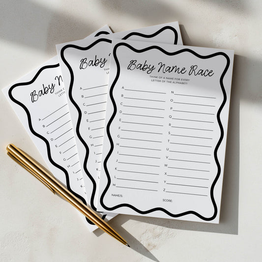 Three sheets of paper with 'Baby Name Race' game on a light surface with a pen.