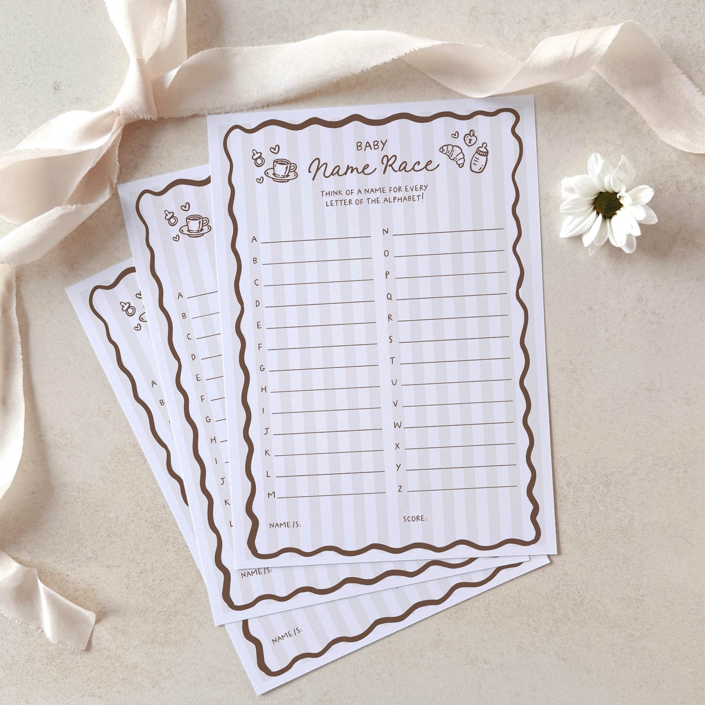 Two baby name race sheets on a light background with ribbons and a flower.