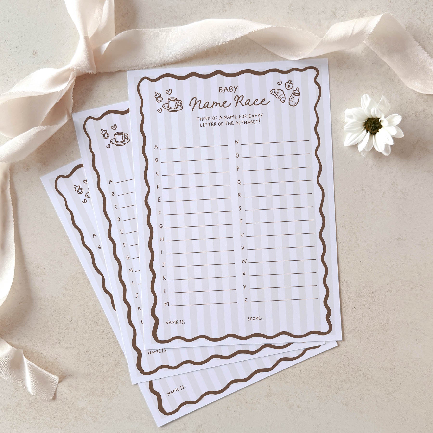 Two baby name race sheets on a light background with ribbons and a flower.