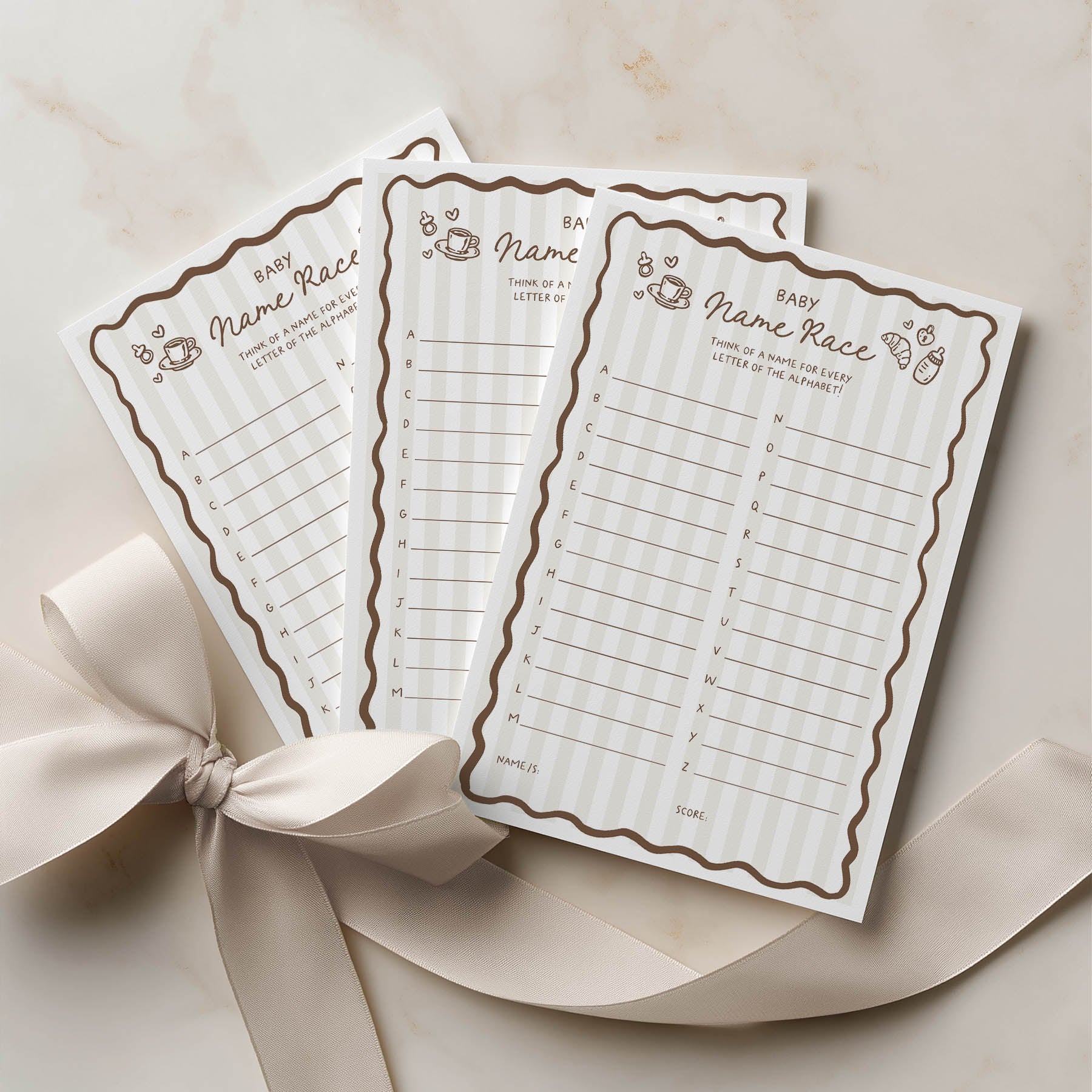 Three baby name race cards with decorative border on a beige background