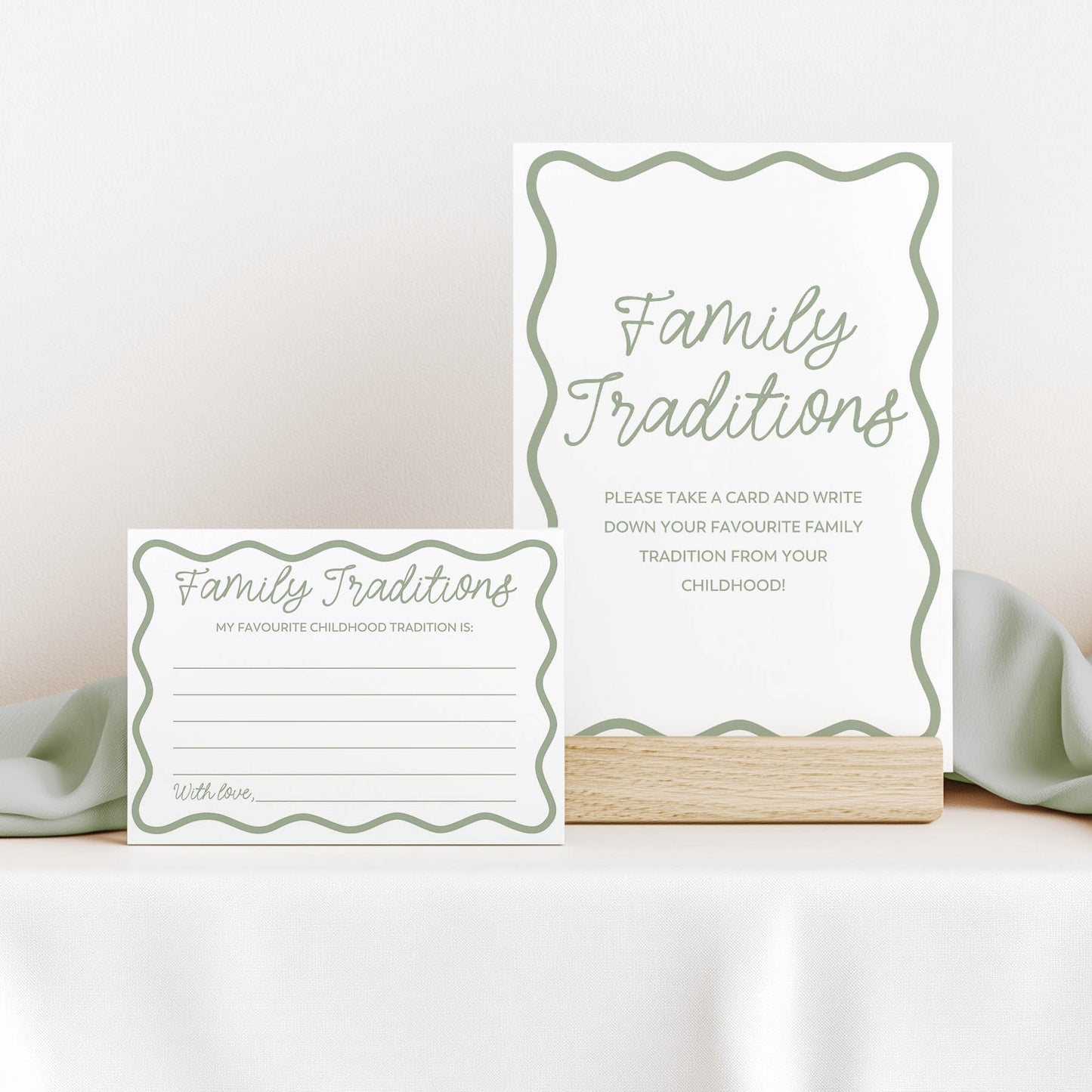 Two  green wavy 'Family Traditions' cards on a white surface with a light background