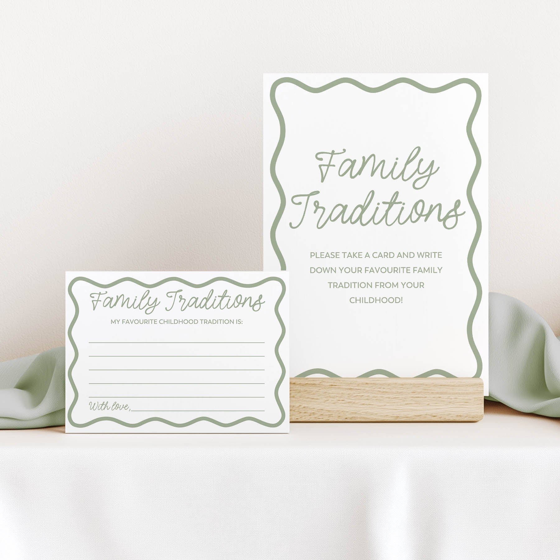 Two  green wavy 'Family Traditions' cards on a white surface with a light background