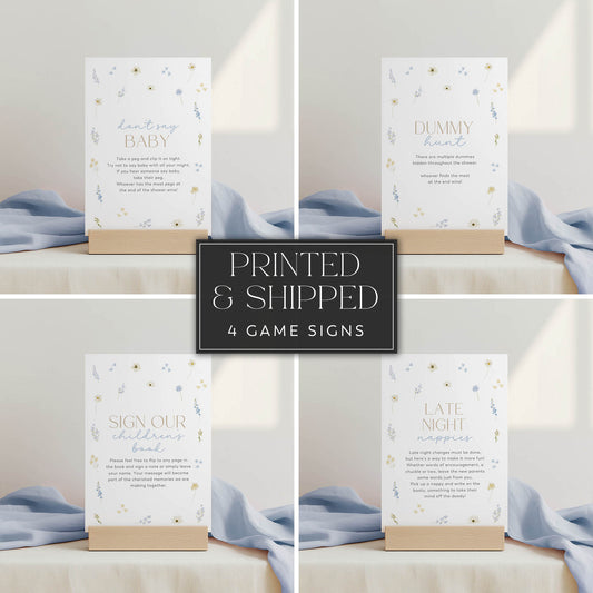 Set of four baby shower game signs with text on a neutral background
