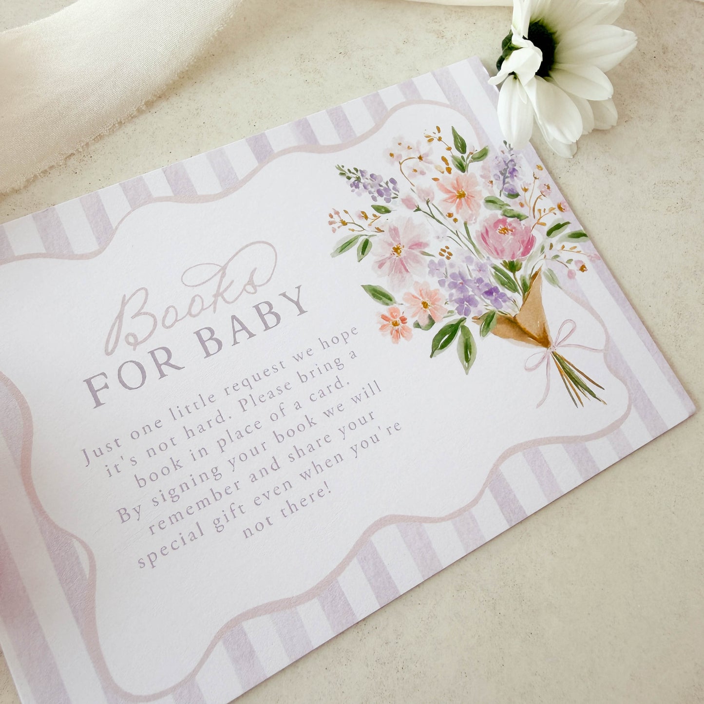 Baby shower invitation with floral design and text on a light background