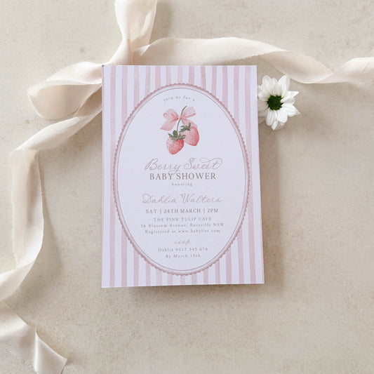 Baby shower invitation with pink and white stripes on a beige ribbon and background