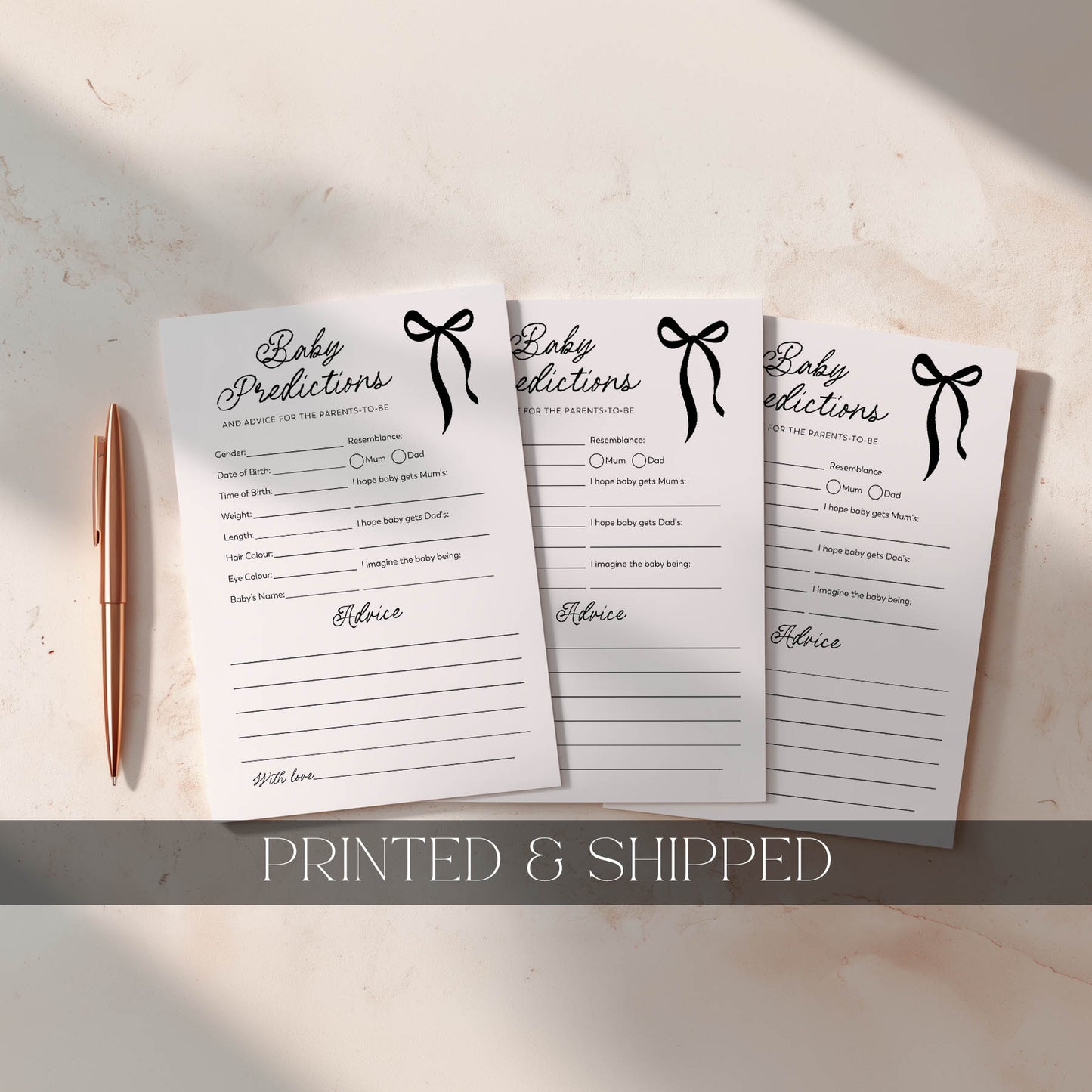 Three sheets of baby predictions with a pen on a light surface, labeled 'Printed & Shipped'.