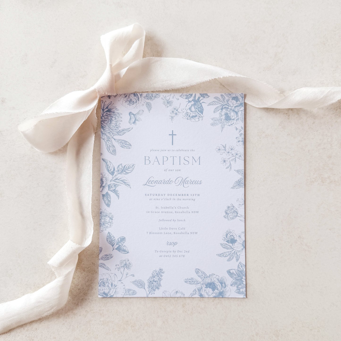 Baptism invitation with floral design on a light background