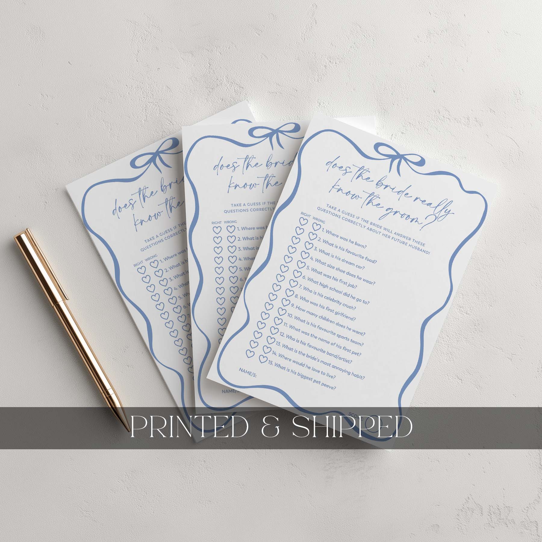 Three printed question cards with blue decorative elements on a light gray background.