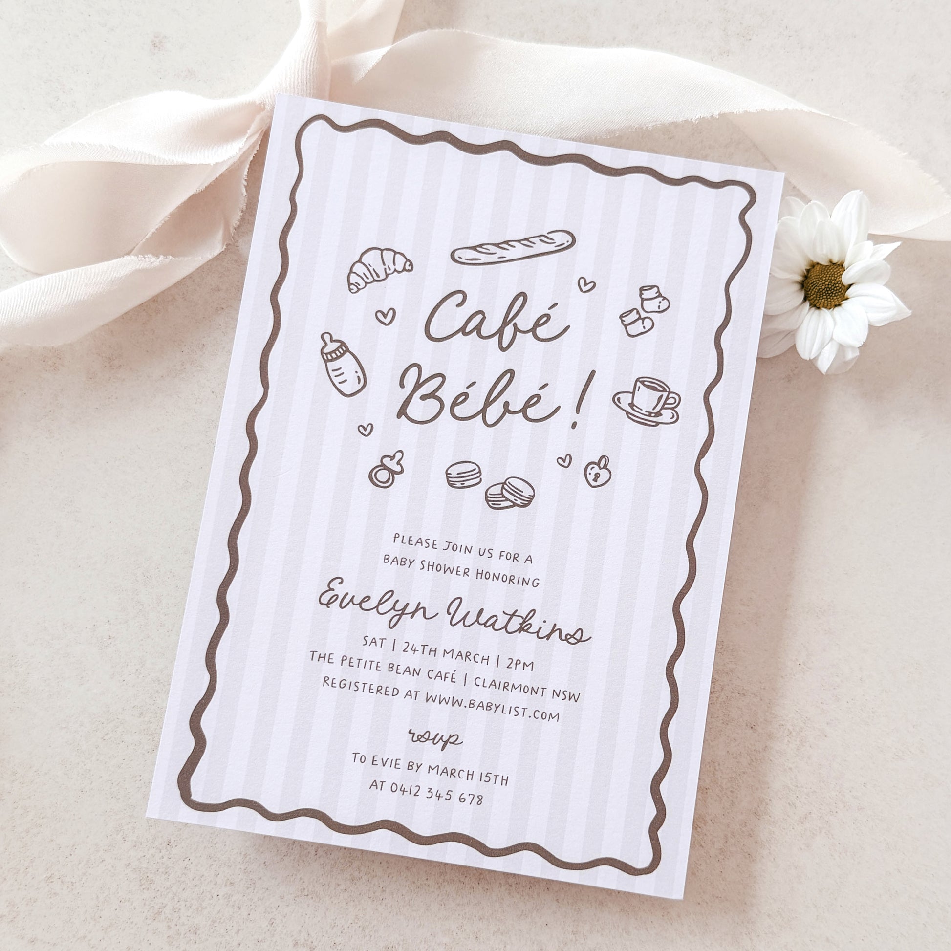 Baby shower invitation card for 'Café Bébé' with illustrations on a light background