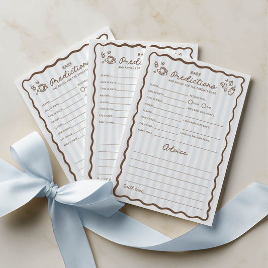 Three baby prediction and advice cards with a decorative blue ribbon on a beige background