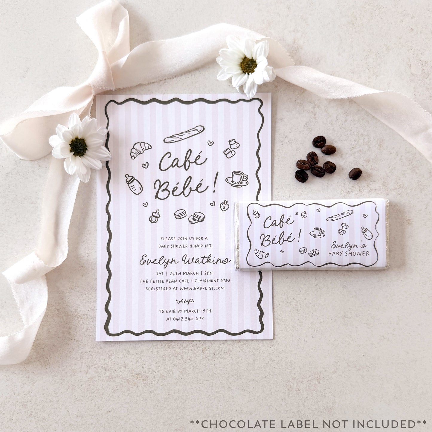 Café Bébé baby shower invitation with coffee beans and flowers on a neutral background