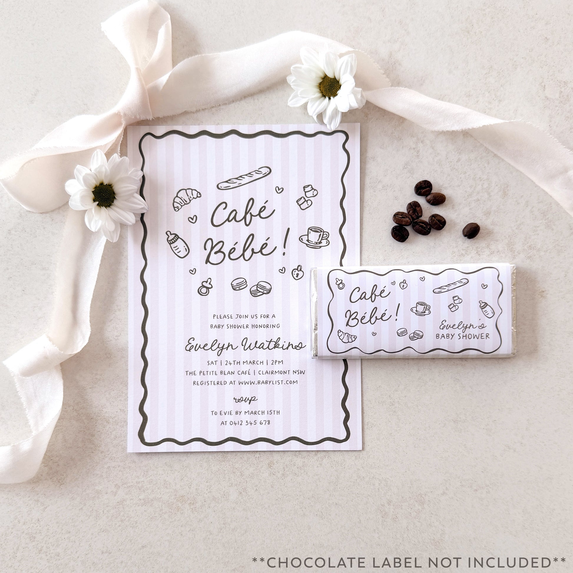 Café Bébé baby shower invitation with coffee beans and flowers on a neutral background