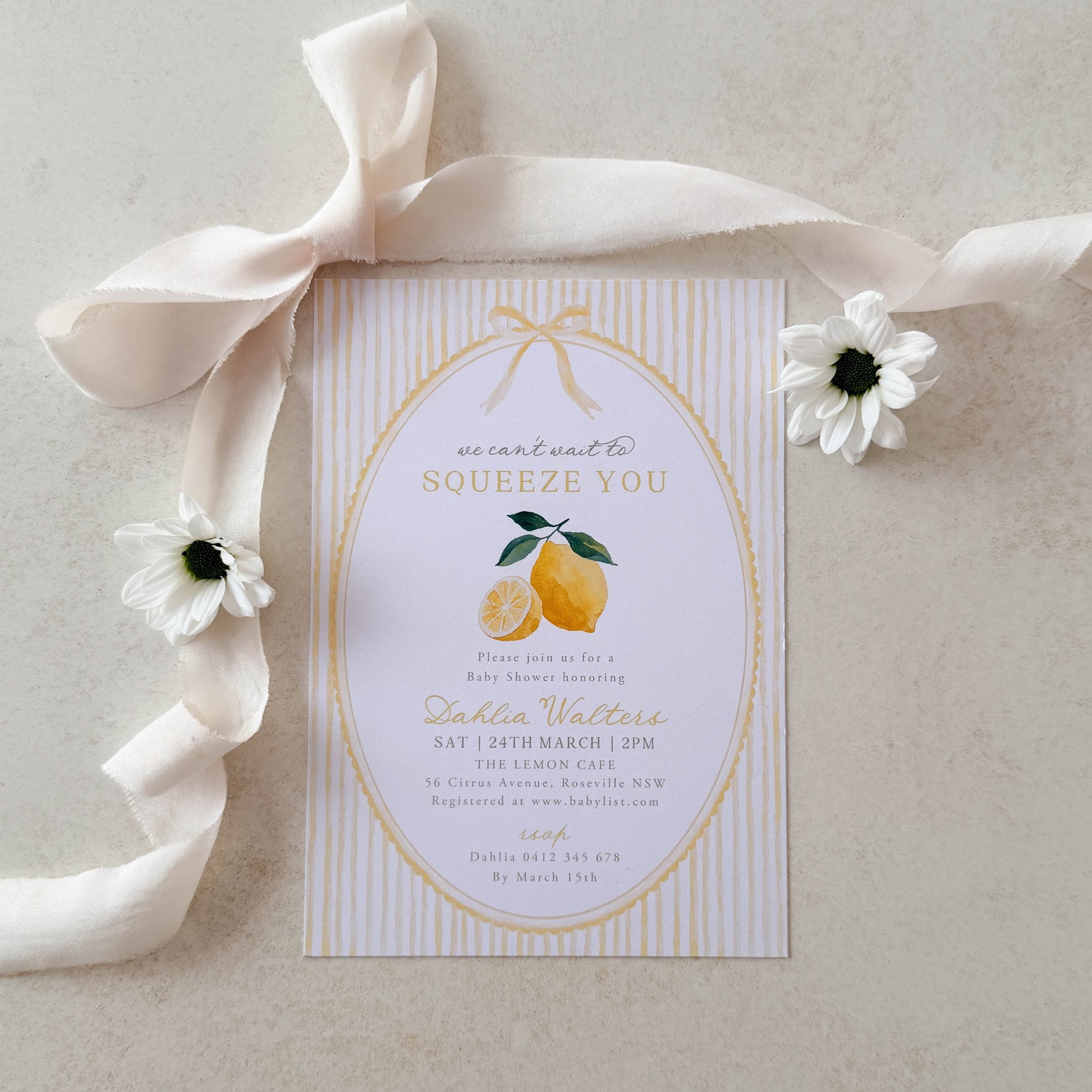 Baby shower Invitation card with lemon design and ribbon on a light background
