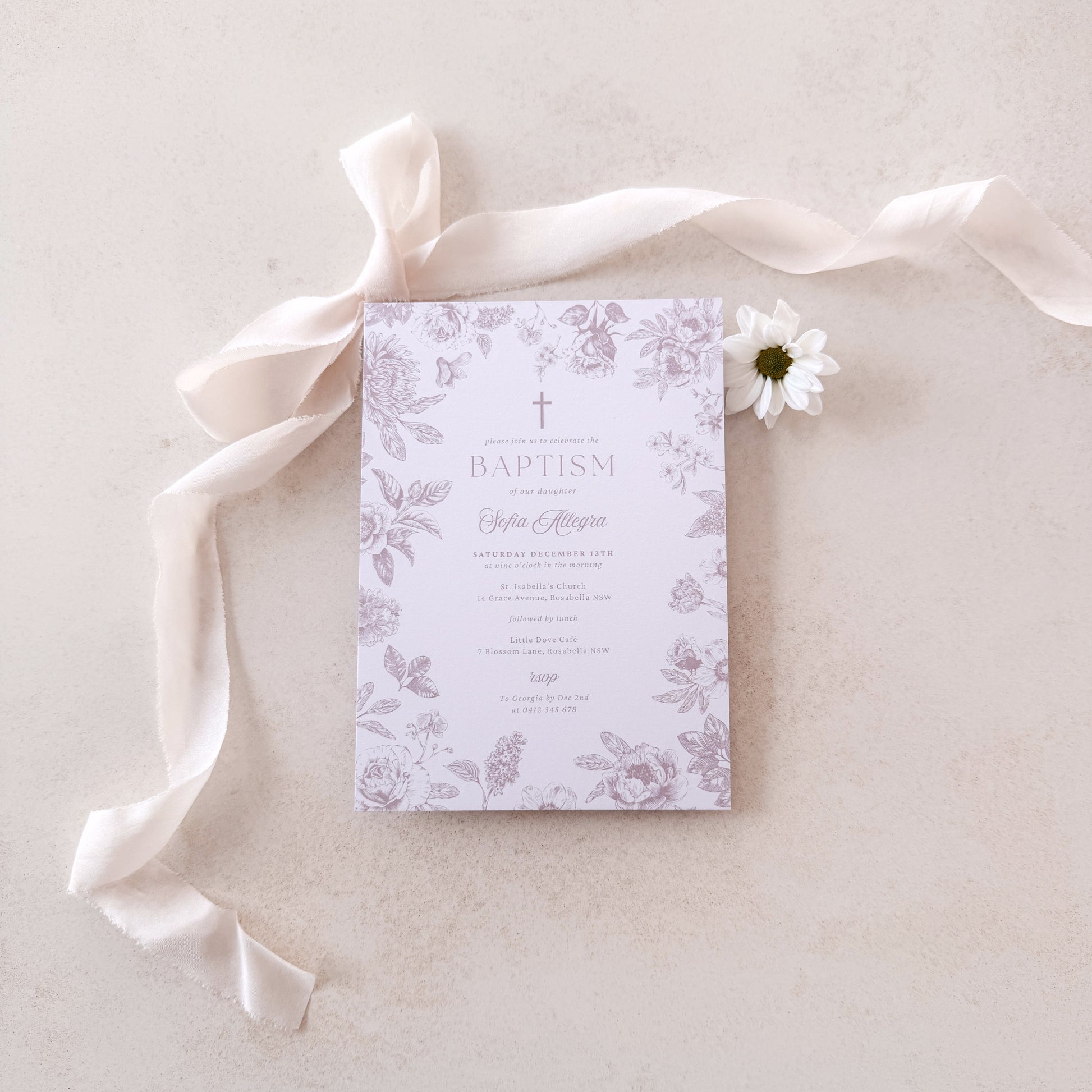 Baptism invitation with floral design on a light background with ribbon and flower