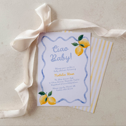 Baby shower invitation with lemons and a ribbon on a light background