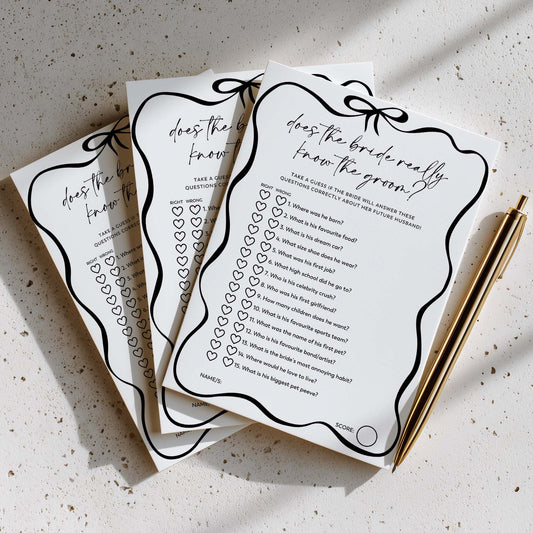 Set of questionnaires for a wedding with decorative elements on a textured surface.