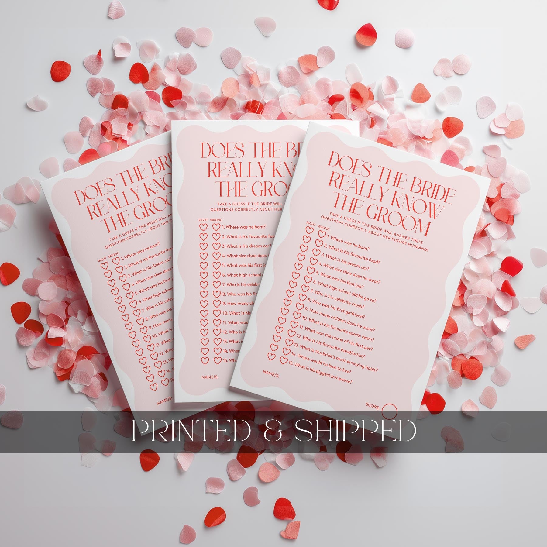 Three 'Does the Bride Really Know the Groom' cards on a white background with red and pink heart-shaped confetti.