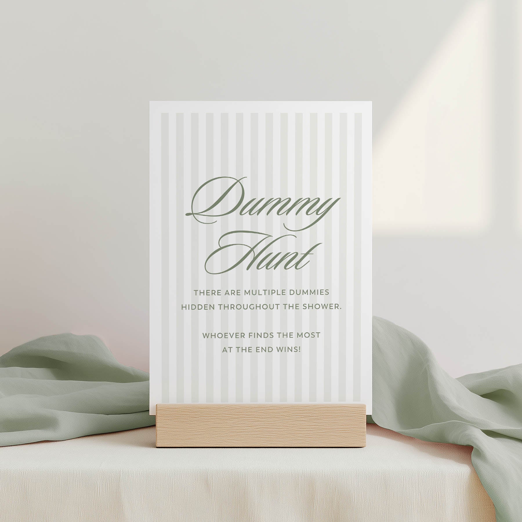 White card with text on a wooden stand against a light background