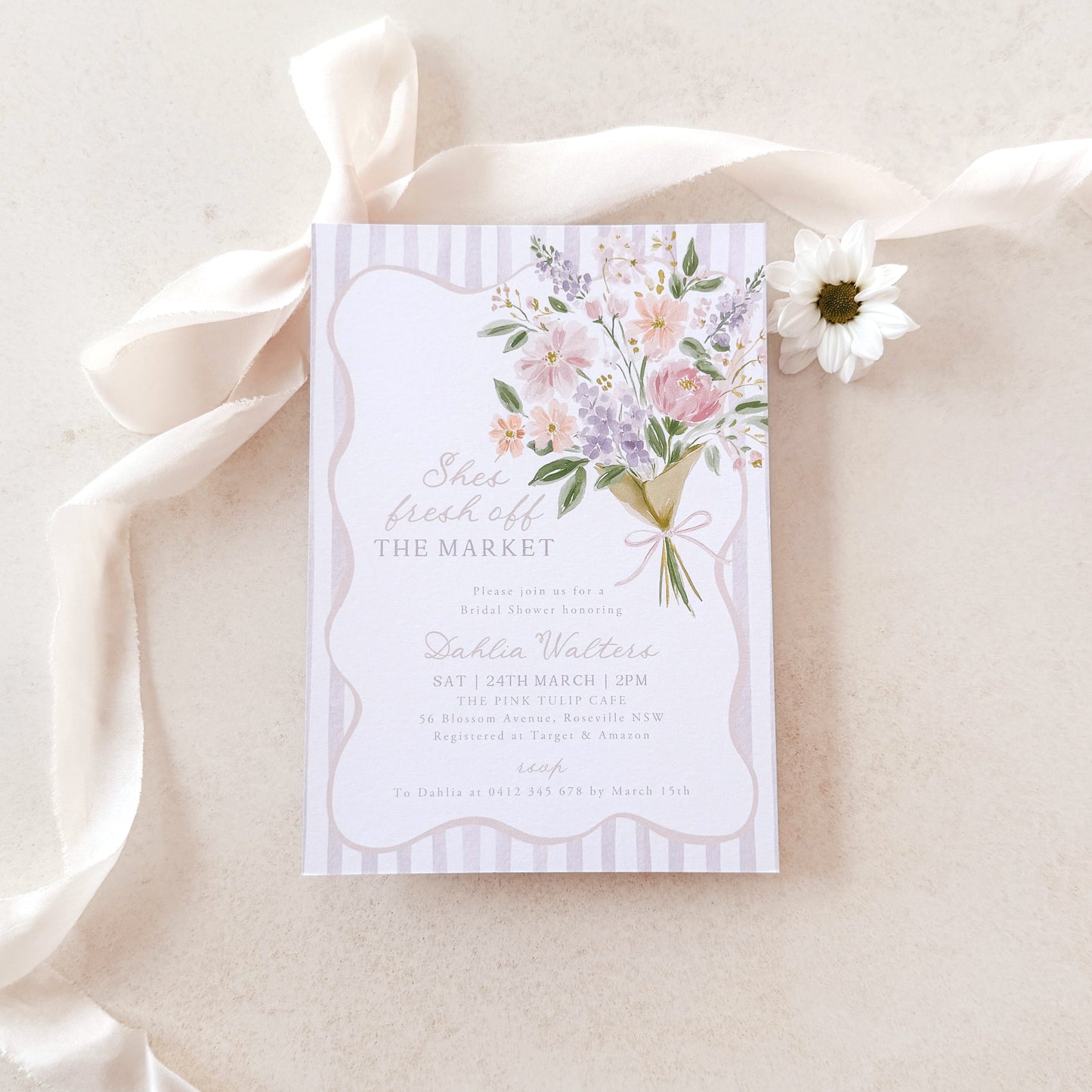 Floral invitation card on a white background with a white ribbon