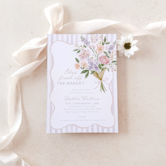 Floral invitation card on a white background with a white ribbon