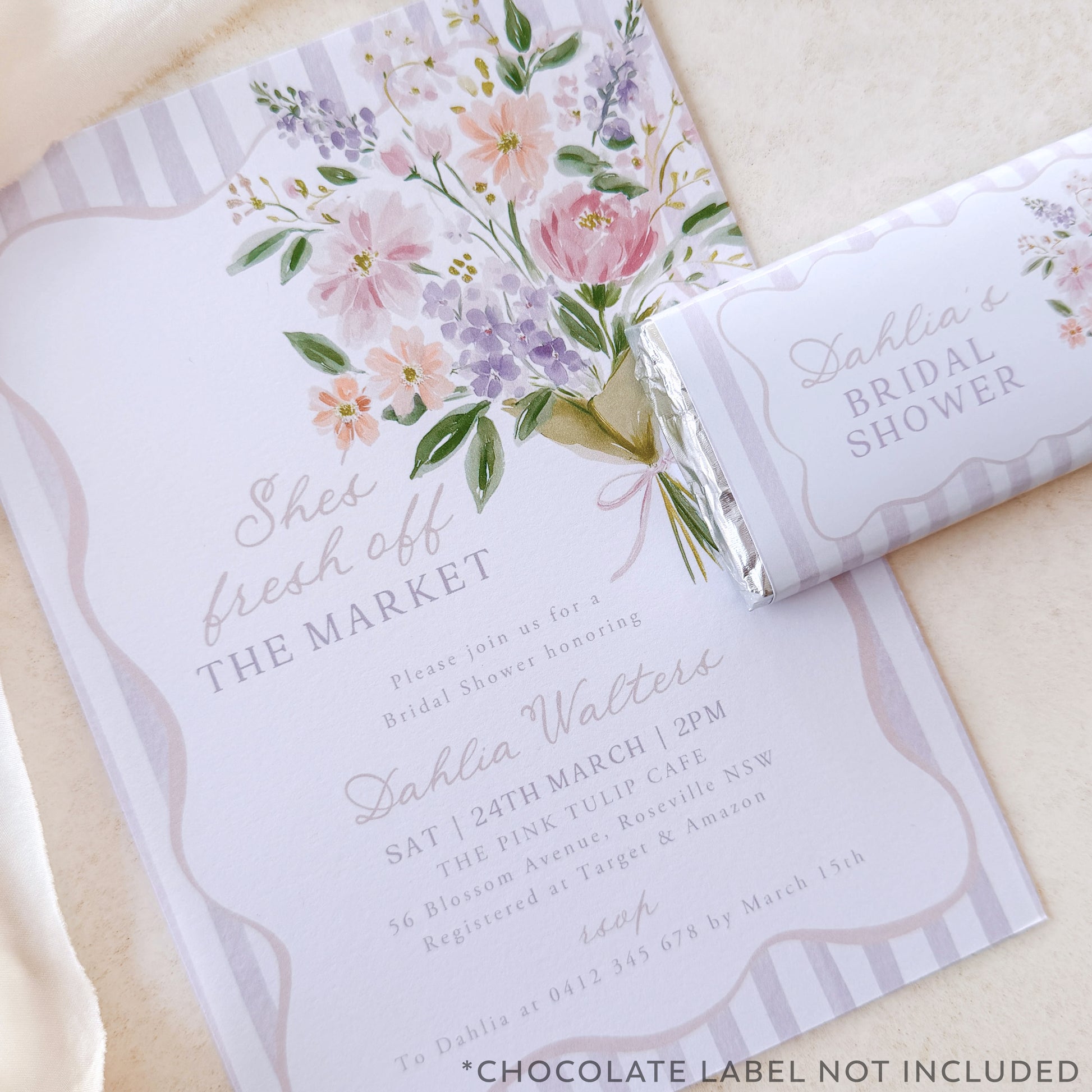 Floral bridal shower invitation with a chocolate bar labeled 'Bridal Shower' on a light background