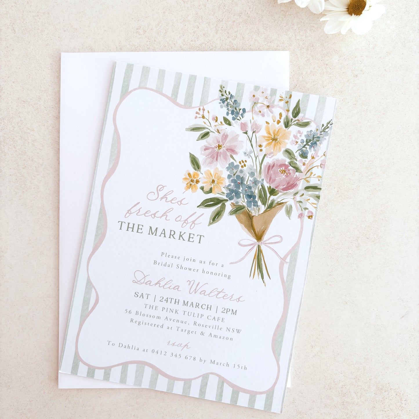 Floral invitation card with a bouquet design on a beige background