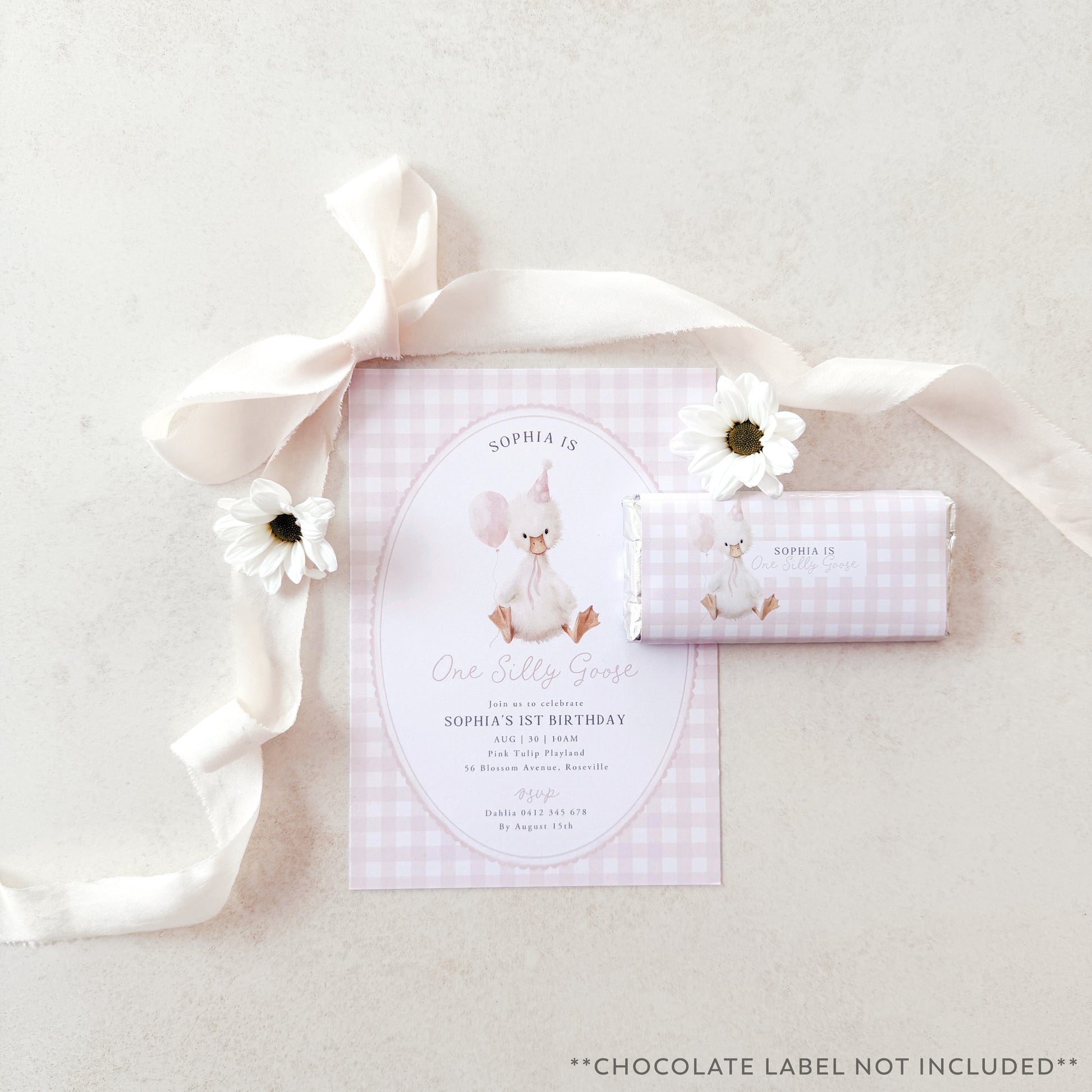 Invitation card with a goose illustration and matching chocolate bar wrapper on a light background