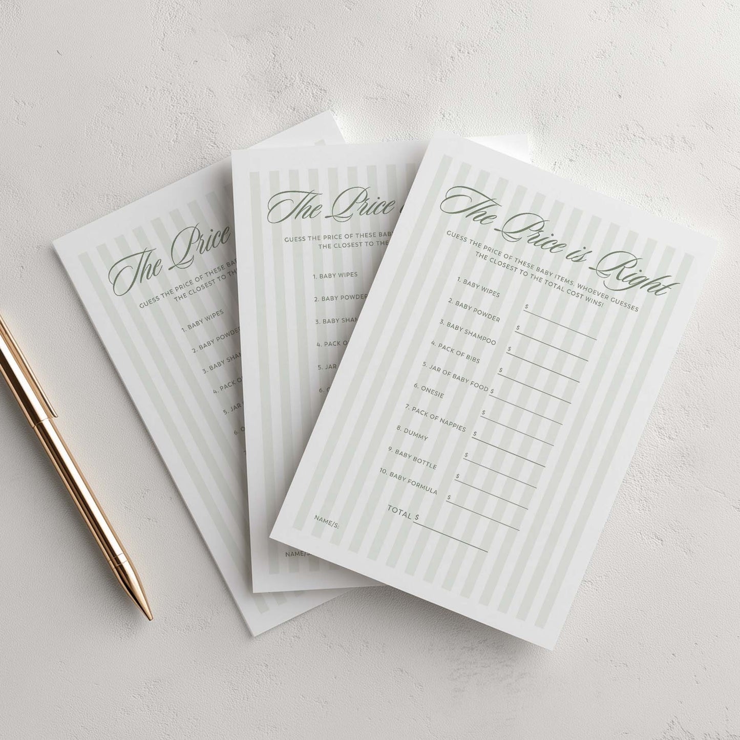 Three 'The Price is Right' game sheets on a light gray surface with a pen.