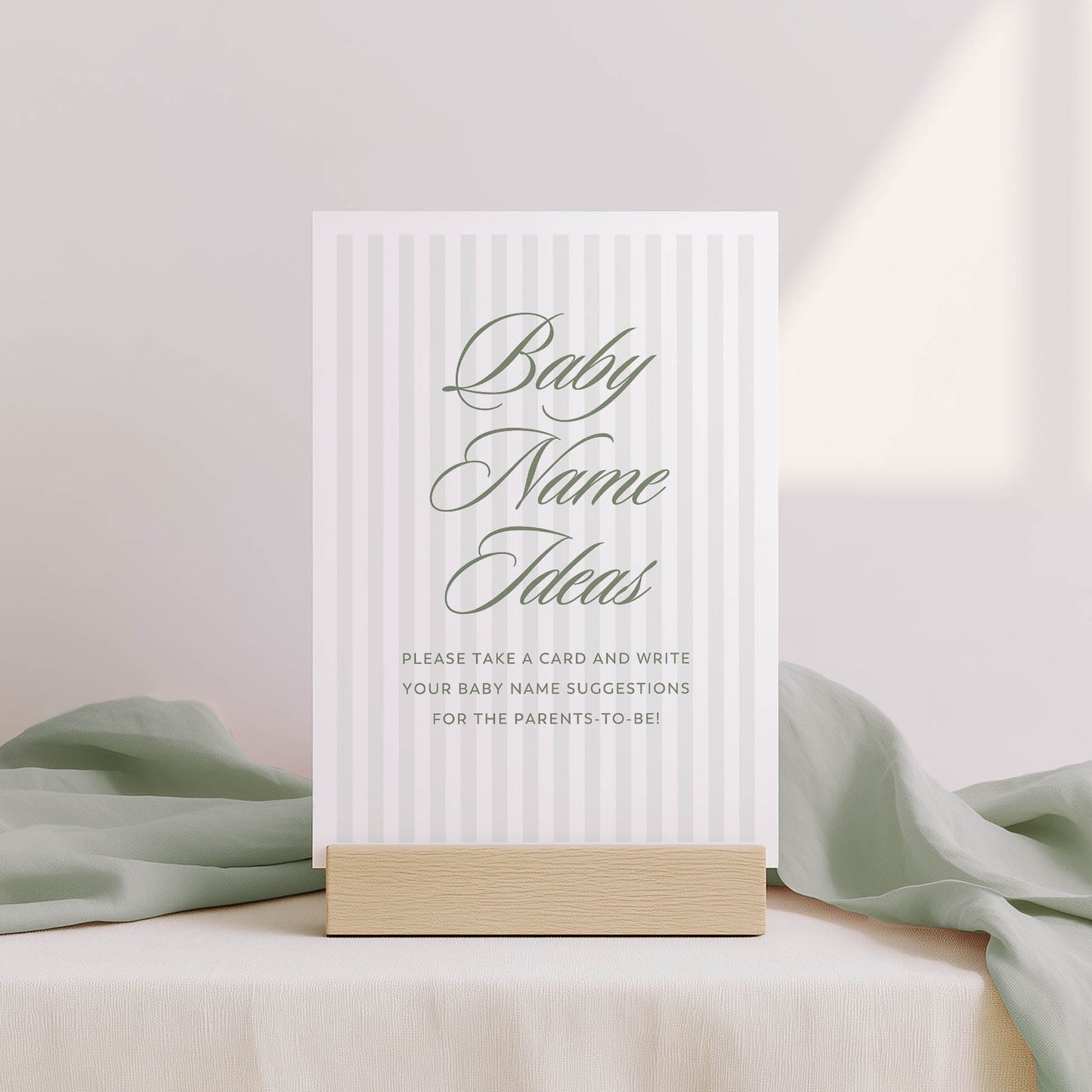 Baby name suggestion card with a wooden stand on a light background