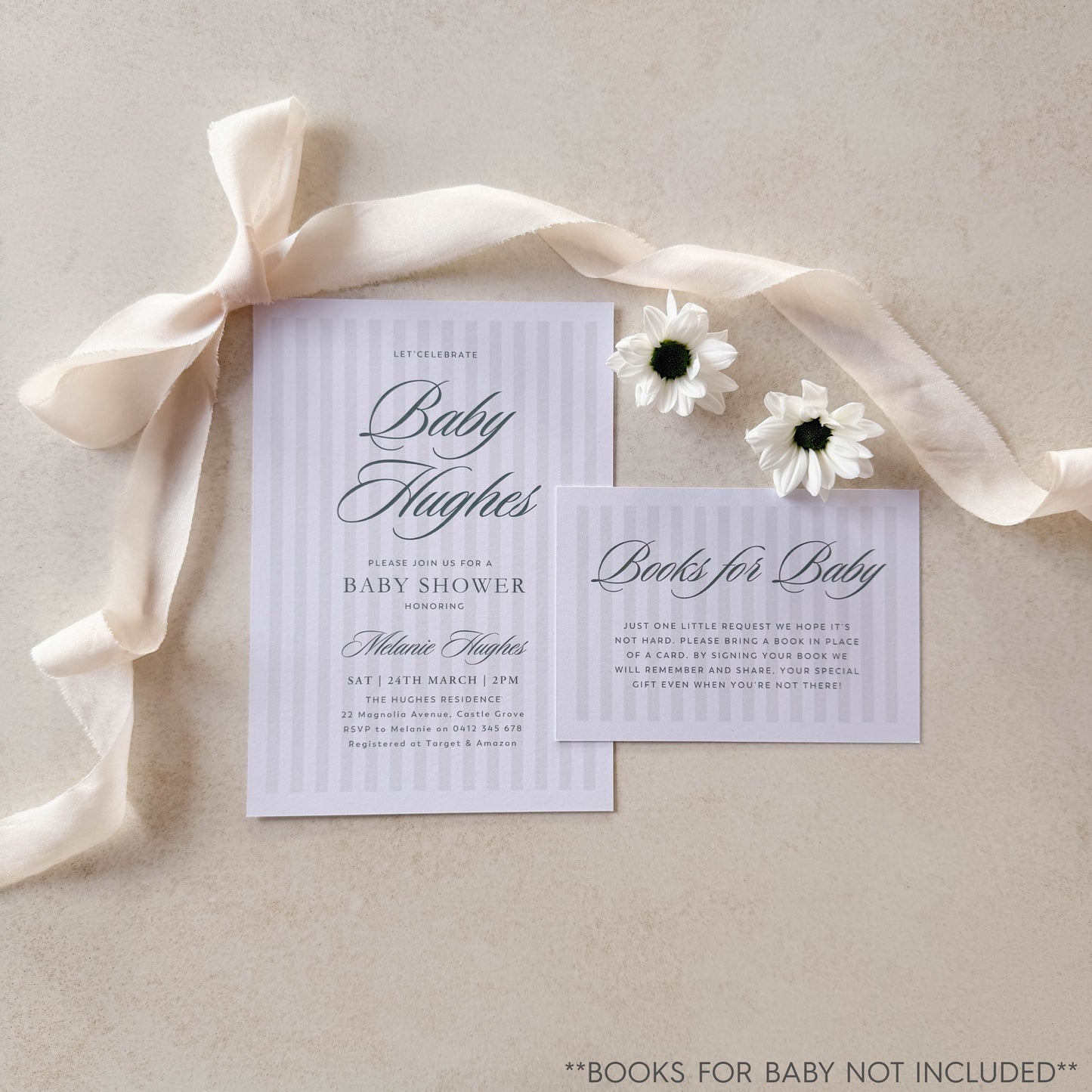 Baby shower invitation with ribbon and flowers on a neutral background