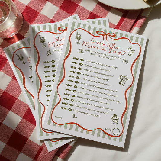 Two questionnaires titled 'Guess Who Mum or Dad?' on a red and white checkered tablecloth.
