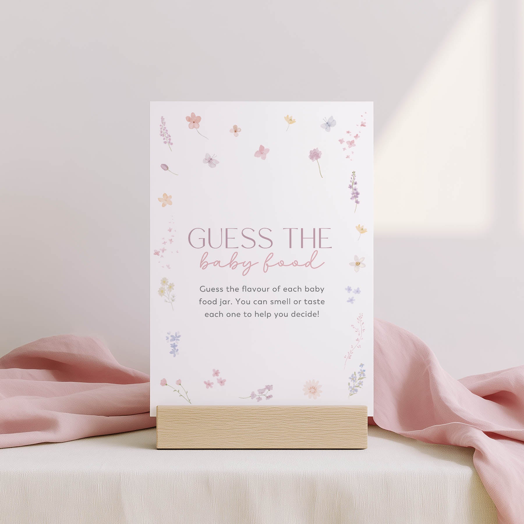 Card with 'Family traditions' text on a stand with floral design, against a light pink background.