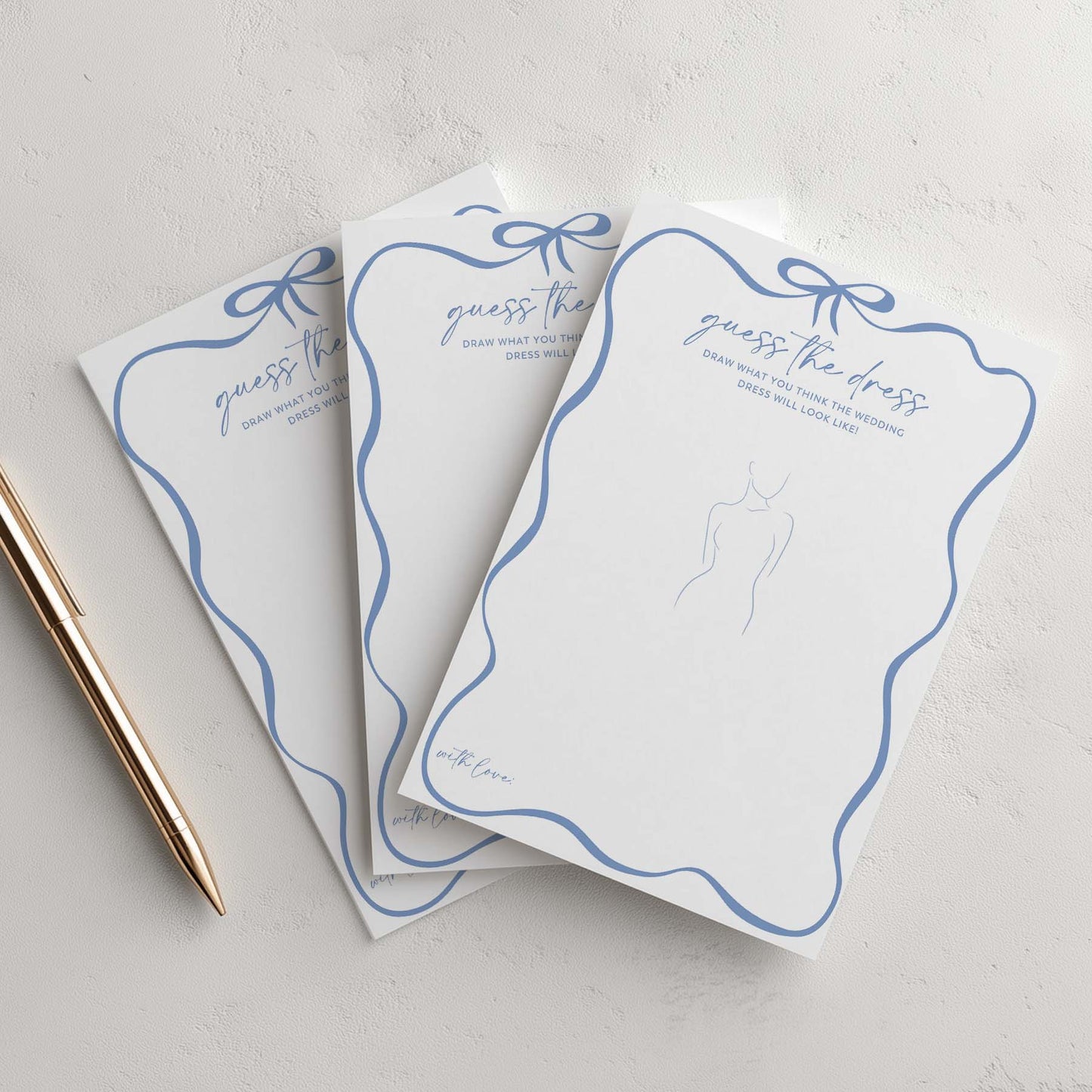 Three 'Guess the Dress' cards with blue ribbons on a light gray background