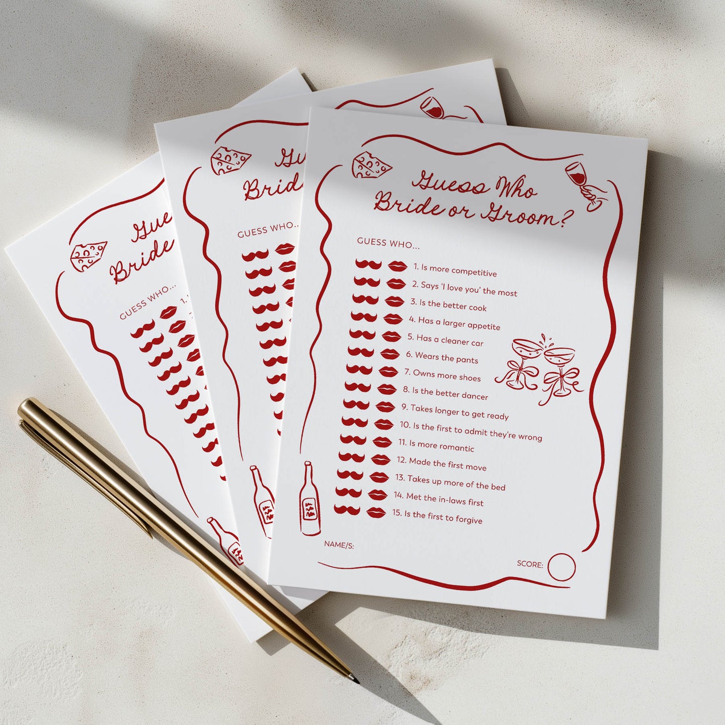 Three cards with bridal shower games on a light surface with a pen.