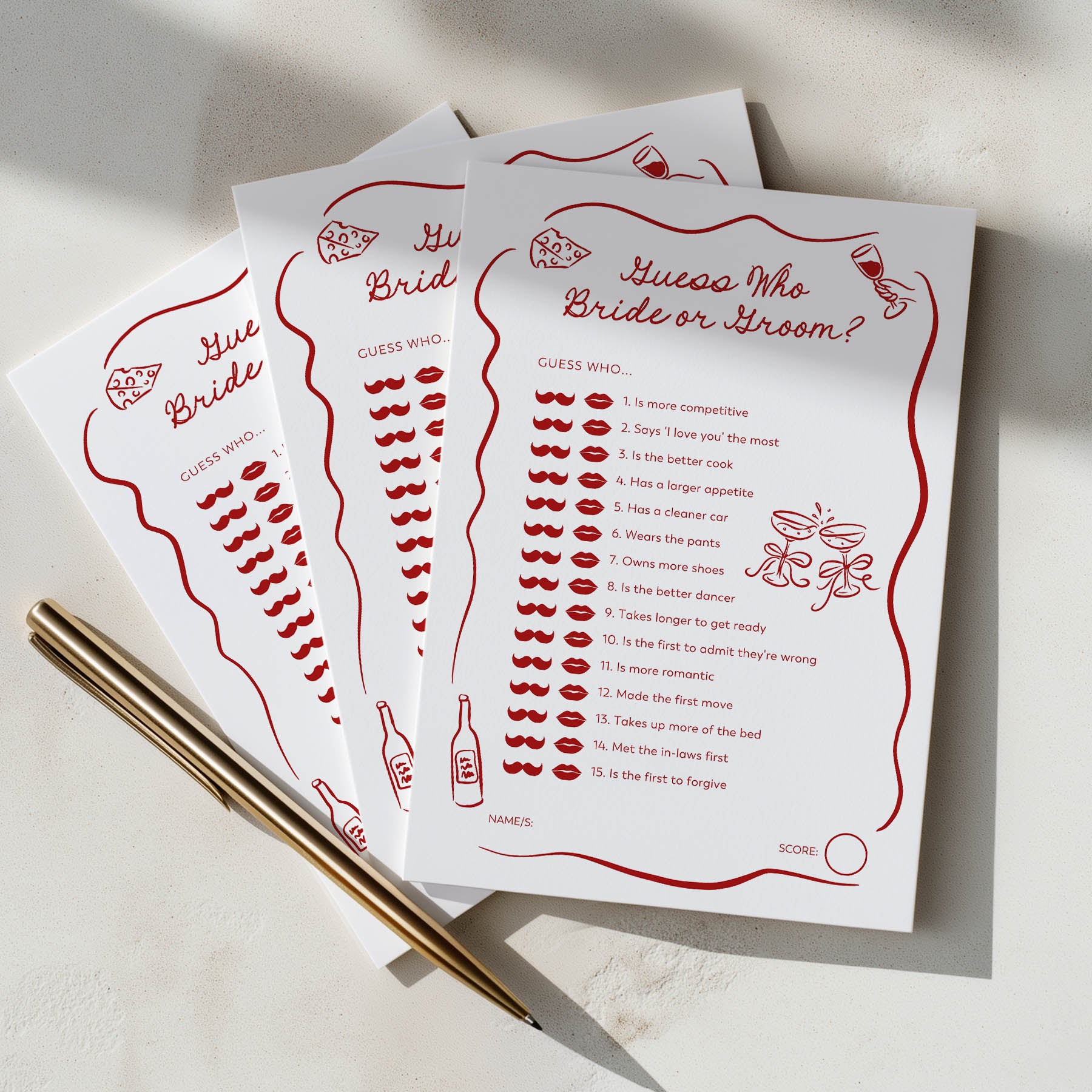 Three cards with bridal shower games on a light surface with a pen.