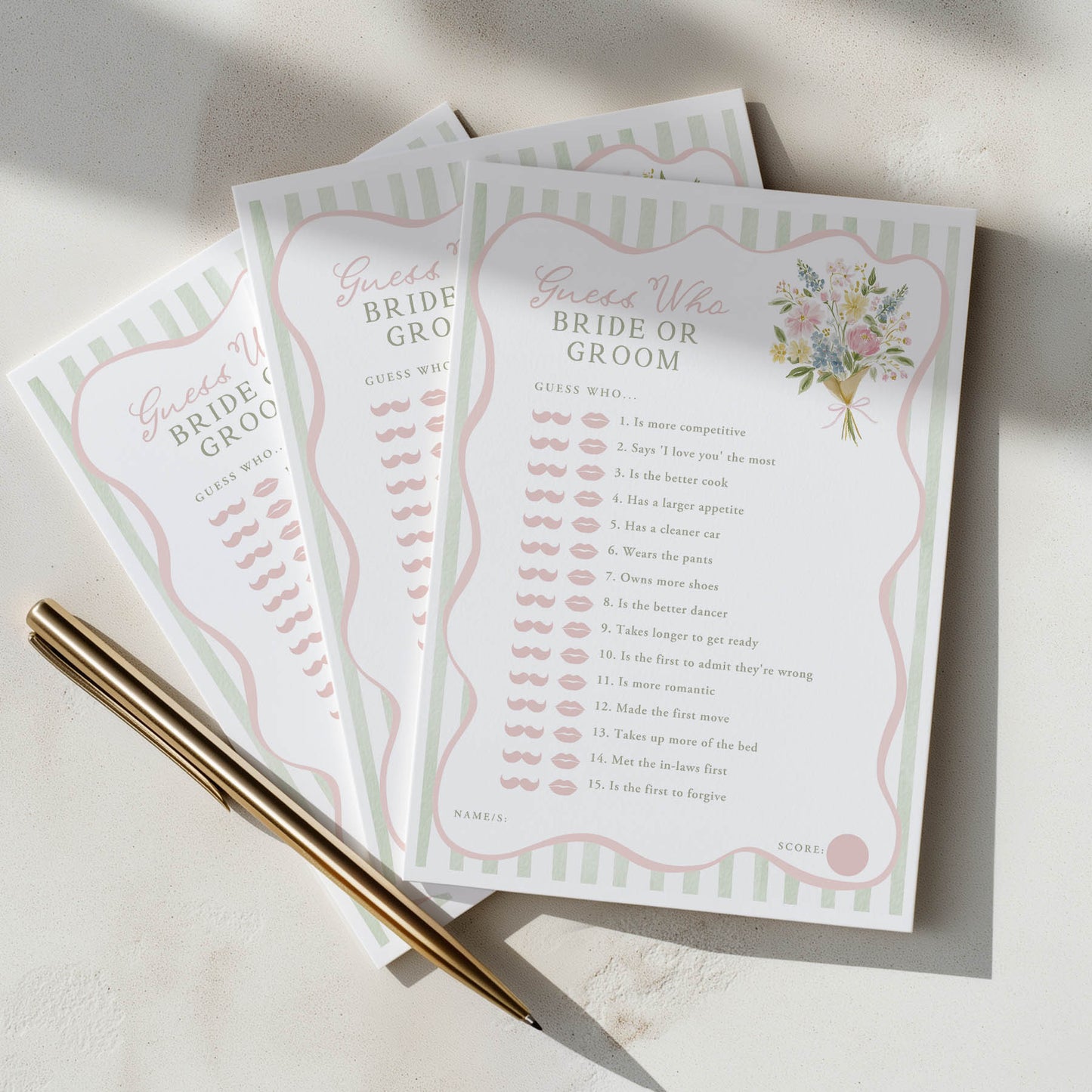Wedding game cards for 'Guess Who: Bride or Groom' with a pen on a light surface