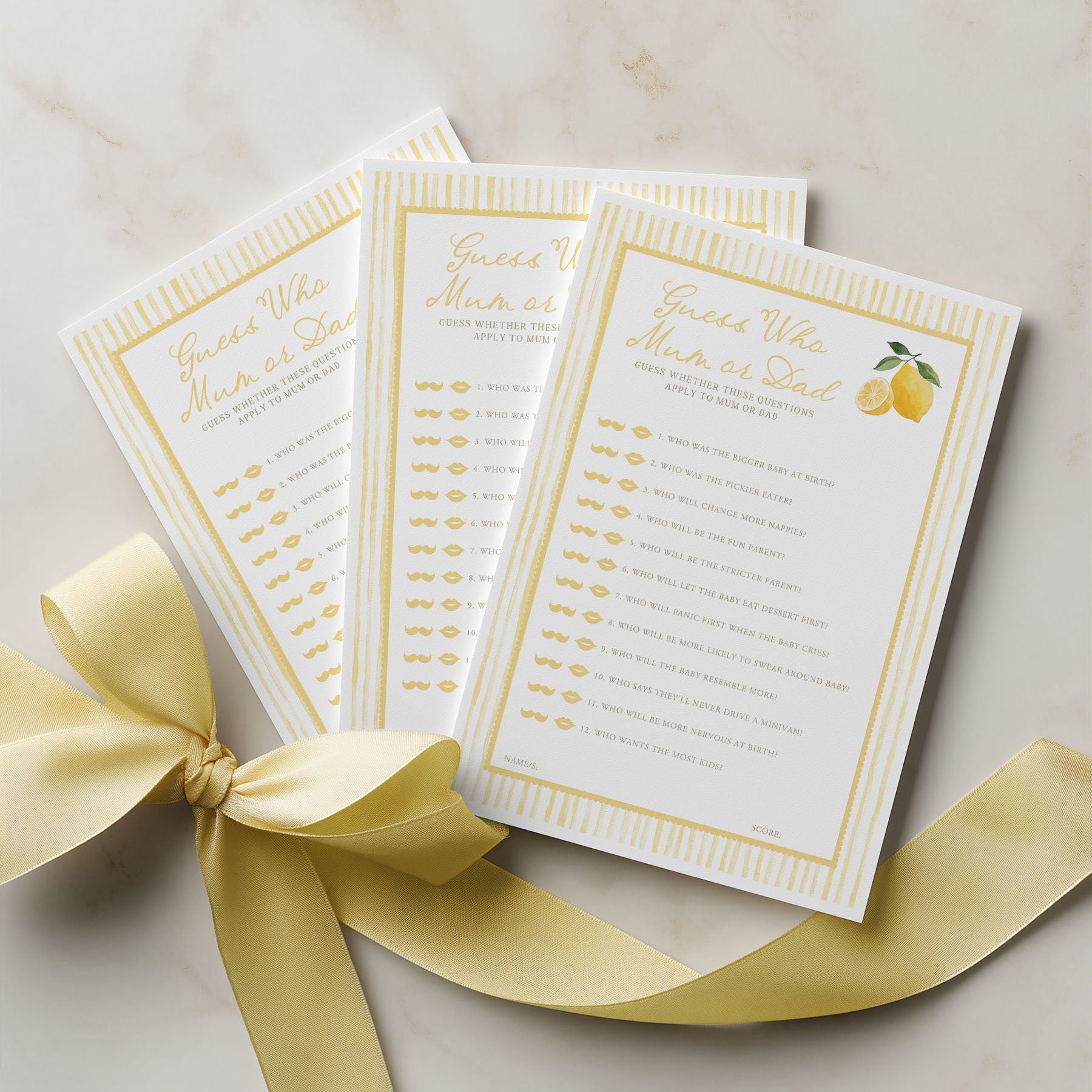 Three white cards with gold text and a yellow ribbon on a light background