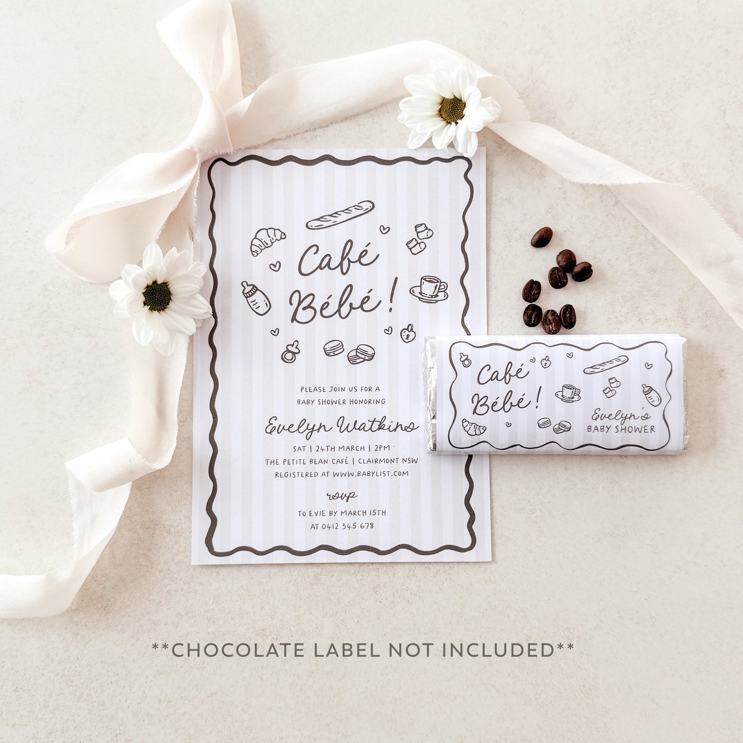Café Bébé baby shower invitation with coffee beans and flowers on a neutral background
