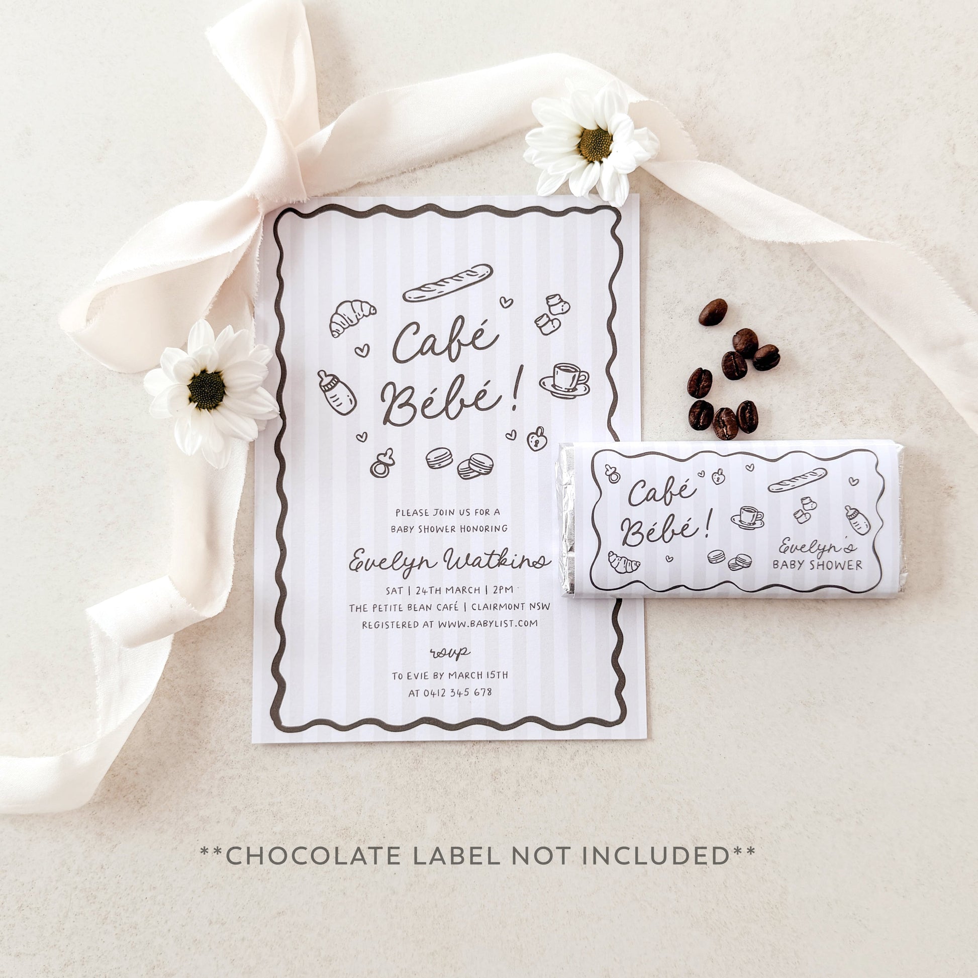 Café Bébé baby shower invitation with coffee beans and flowers on a neutral background