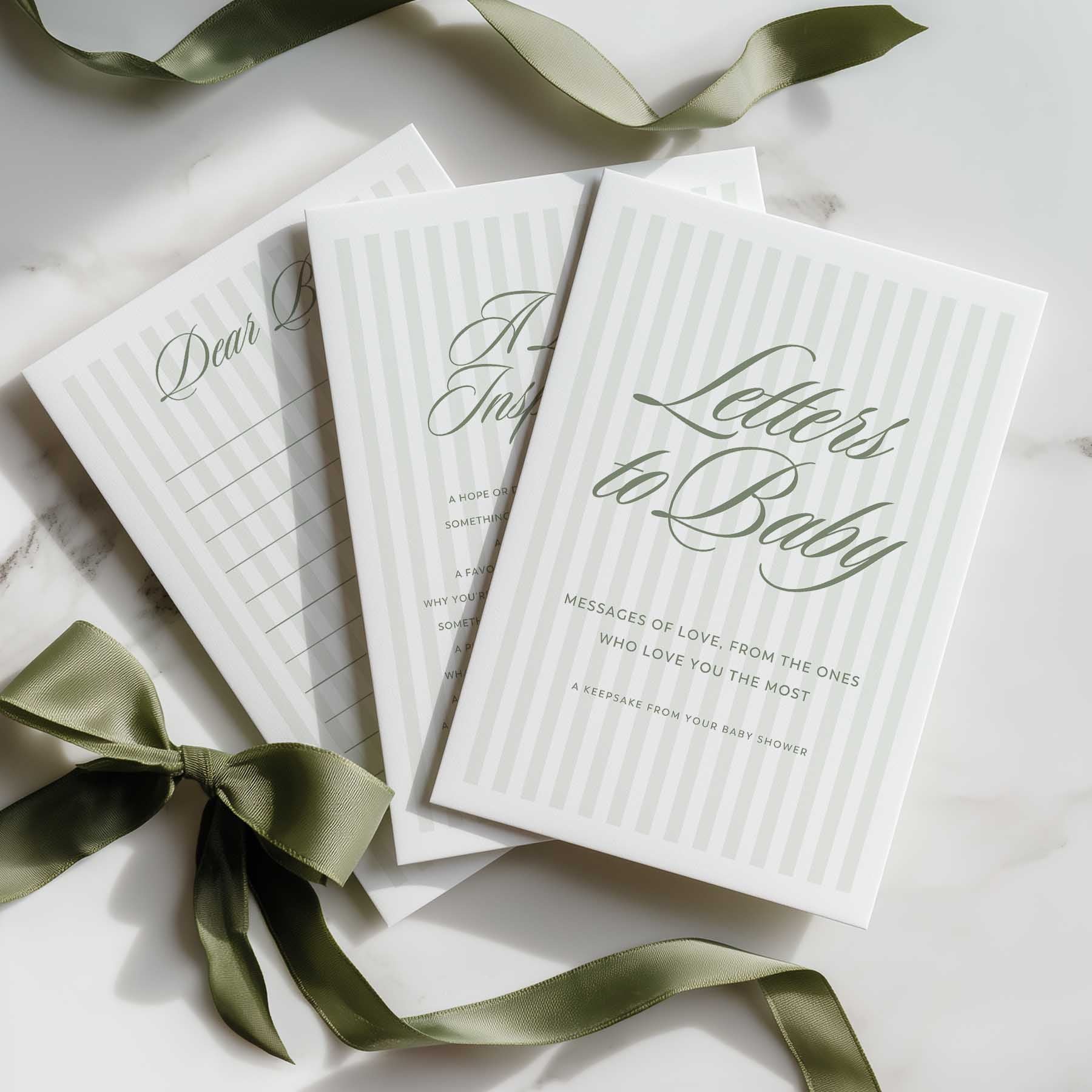 Sage Green Stripe Book titled 'Letters to Baby' with green ribbons on a light surface