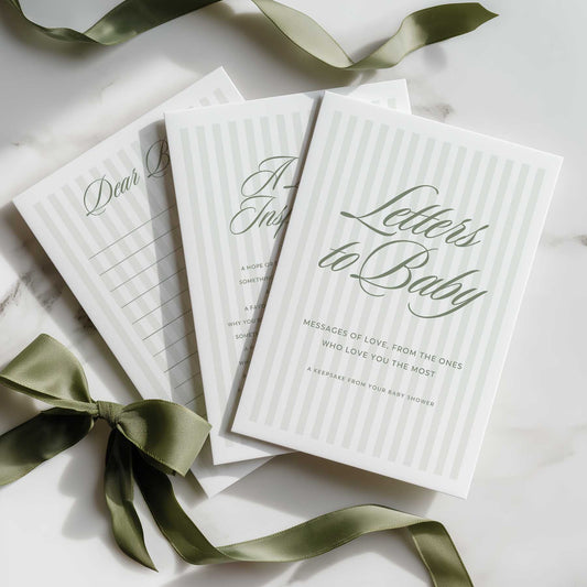 Sage Green Stripe Book titled 'Letters to Baby' with green ribbons on a light surface