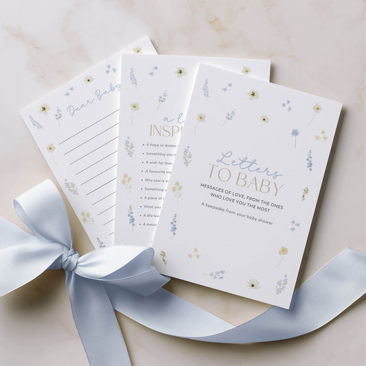 Set of 'Letters to Baby' cards with a ribbon on a light background