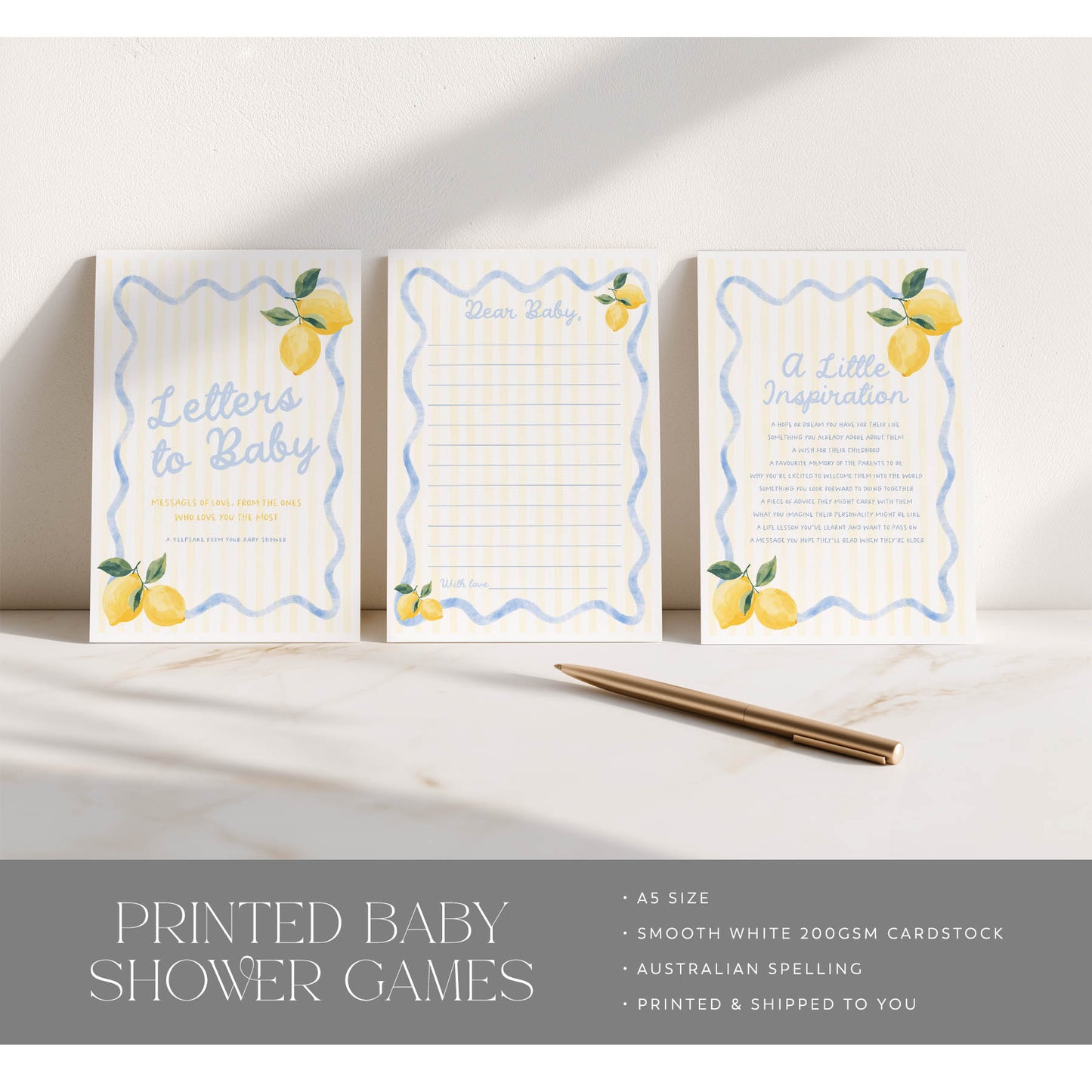 Three printed baby shower games with lemon designs on a white surface.