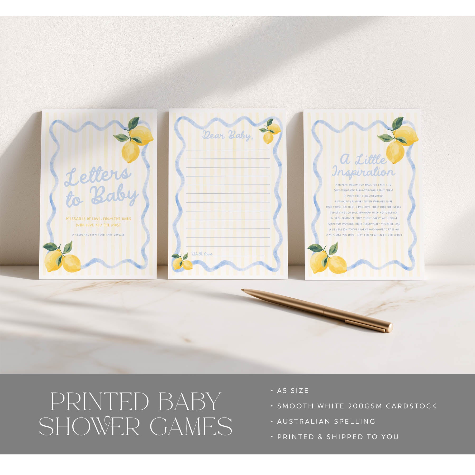 Three printed baby shower games with lemon designs on a white surface.