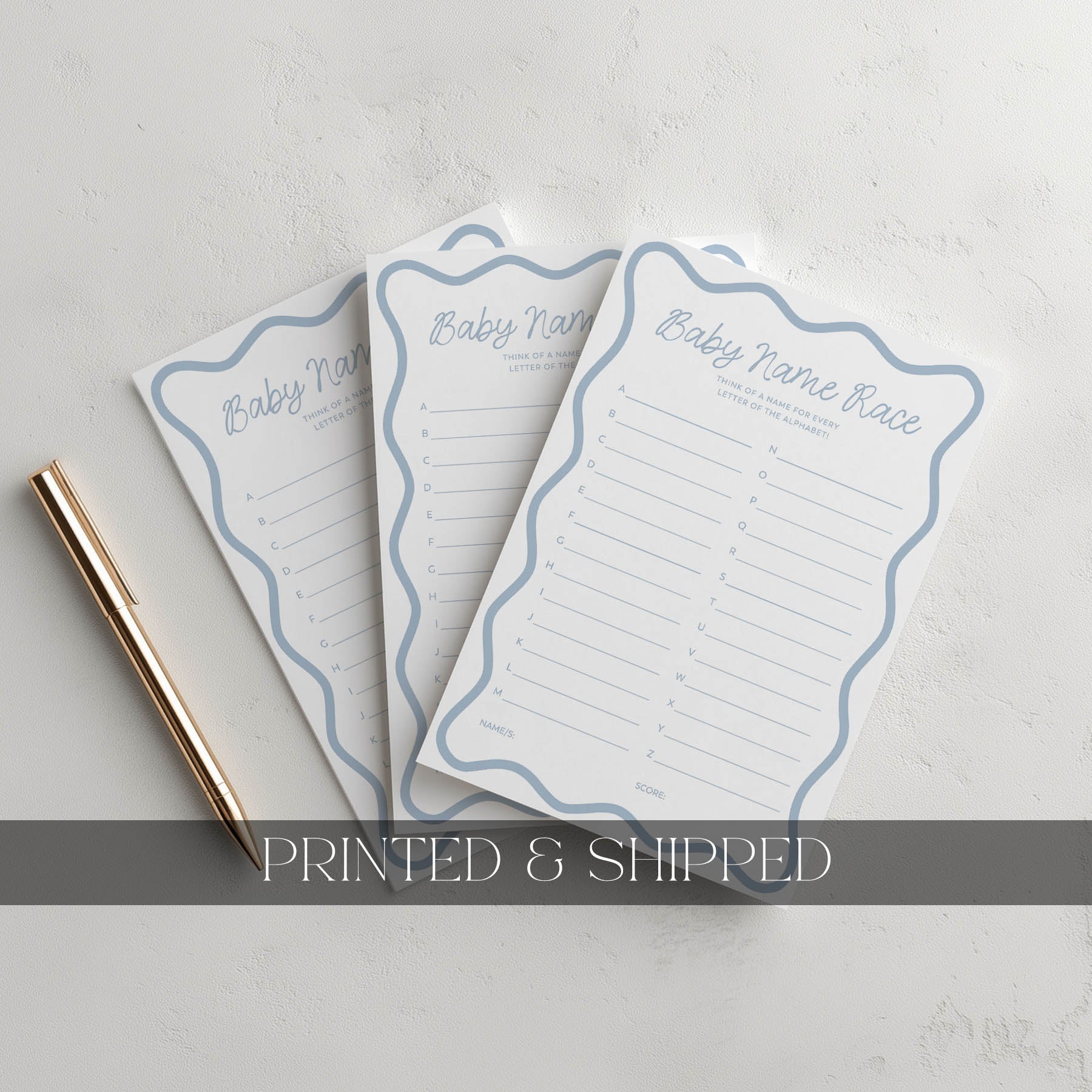 Three printed baby shower invitations with blue borders on a light gray background.