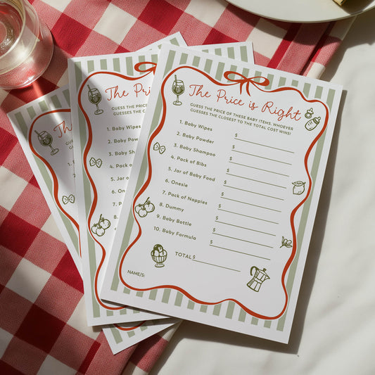 Baby shower game cards titled 'The Price is Right' on a red and white checkered tablecloth.